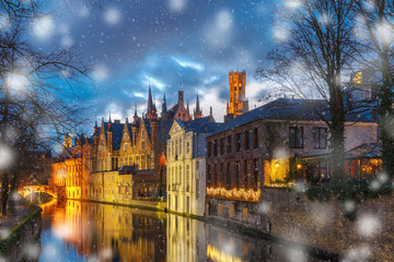 Fototapeta premium Christmas night cityscape with a medieval tower Belfort and the Green canal, Groenerei, in Bruges, Belgium