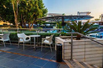 resort area with swimming pool, palm trees, sunset, Europe, Greece, Rhodes.