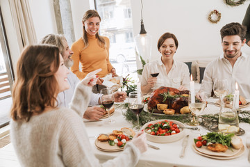 Happy big family celebrating Christmas together at home