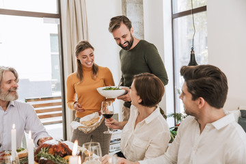 Happy big family celebrating Christmas together at home