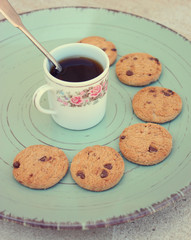 cup of coffee and cookies on wooden table