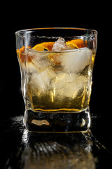 Classic whisky over ice in a traditional cut glass tumbler.