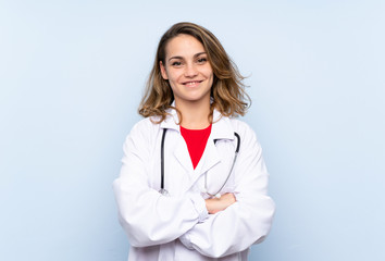 Young blonde woman with doctor gown