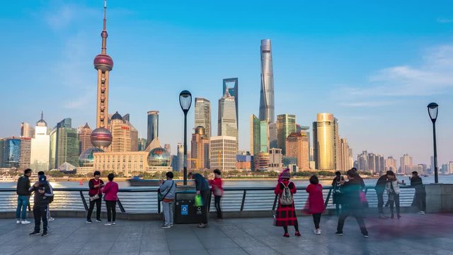 Sunny Day Time-lapse or Hyper-lapse View of Oriental Pearl Tower and Financial Center in Pudong. Shanghai Tower and Lujiazui on the Bund by Huang Pu River  in Waitan. Motion Blur Along Riverfront,