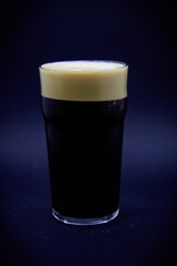 Black beer on black background