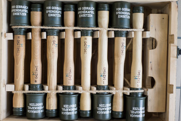 World War II fragmentation grenades stacked in a military box. Gun shop