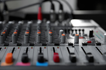 Modern audio mixing console, closeup. Music equipment