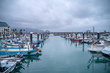 Fototapeta na wymiar The Fishing Boats parking at Fisherman's wharf tamsui,waterfront area is popular travel destination on tamsui, Taipei, Taiwan.