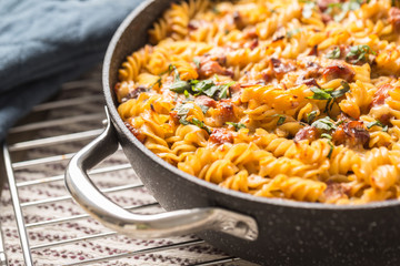 Baked pasta fusilli with smoked pork neck mozzarela cheese and othe ingredients