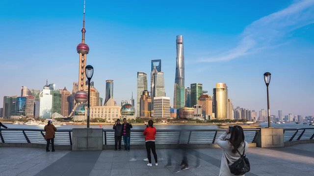 Sunny Day Time-lapse or Hyper-lapse View of Oriental Pearl Tower and Financial Center in Pudong. Shanghai Tower and Lujiazui on the Bund by Huang Pu River  in Waitan. Motion Blur Along Riverfront,
