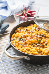 Baked pasta fusilli with smoked pork neck mozzarela cheese and othe ingredients
