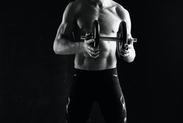 Fototapeta na wymiar muscular man lifting weights