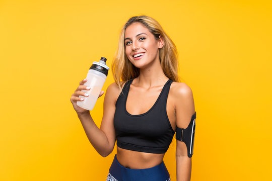 Young Sport Woman With A Bottle Of Water Over Isolated Background