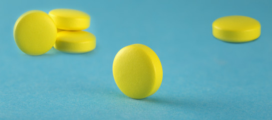 Medical pills are yellow in color. Images for the pharmaceutical industry. The concept of medicine.