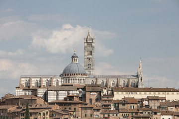 Fototapeta na wymiar Lateral view of the Siena cathedral, a medieval church in Siena, Tuscany, Italy