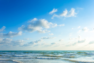 Beautiful early morning sunrise over the sea the horizon,blue sky background texture with white clouds sunset.