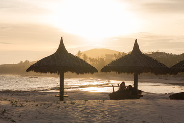 Amazing sunset beach landscape. silhouette. people relax
