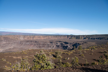 landscape view across a volcanic crater showing the results of multiple eruptions on Hawaii