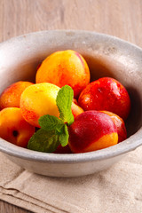 juicy fresh ripe peaches in a metal plate