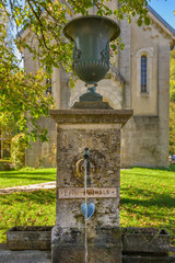 Obraz premium Drinking water fountain in the village of Planches-près-Arbois, in the Jura Department in France.
