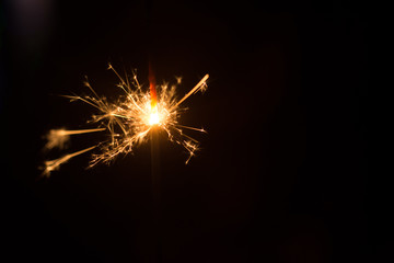 Lit Sparklers Against Black Background