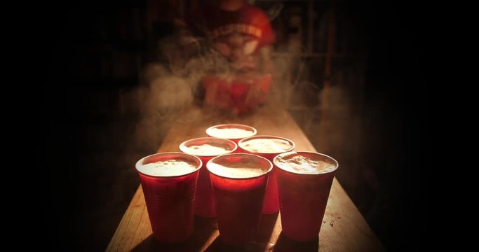Playing beer pong in College