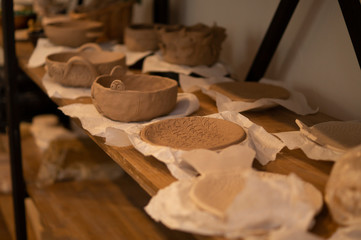 clay dishes on shelf