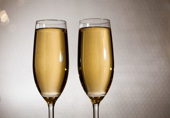 Drink. Two glasses white wine, light background