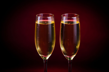 Drink. Two glasses white wine, dark background