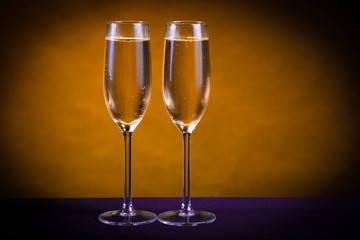 Drink. Two glasses white wine, dark background