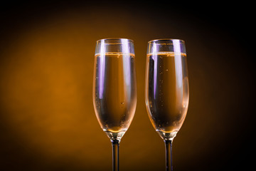 Drink. Two glasses white wine, dark background