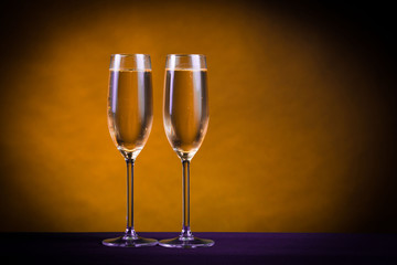 Drink. Two glasses white wine, dark background
