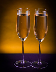 Drink. Two glasses white wine, dark background