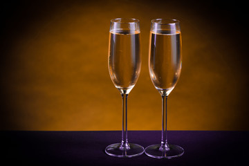 Drink. Two glasses white wine, dark background