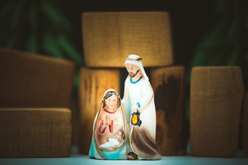 Christmas nativity scene of born child baby Jesus Christ in the manger with Joseph and...