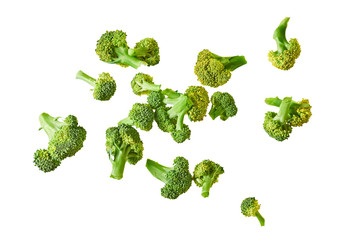 Scattered branches of fresh green broccoli isolated on white background without shadow. Top view