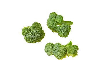 Three branches of fresh green broccoli isolated on white background without shadow. Close-up