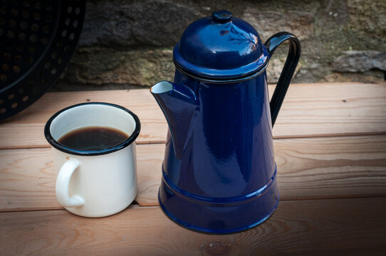 Old enamel coffee mug and pot.