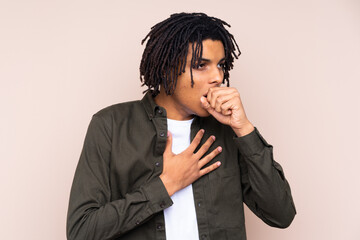 Young African American man over isolated background is suffering with cough and feeling bad