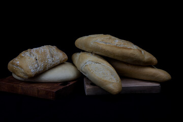 wheat crusty bread on wooden boards