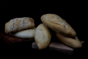 wheat crusty bread on wooden boards
