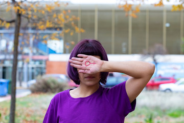 Woman with the female symbol drawn oh her hand