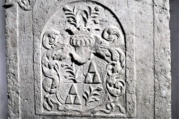 Riga, Latvia, November 2019. Coat of arms of an old family on the wall of a catholic cathedral.