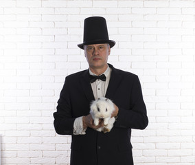 portrait of a magician with a white rabbit