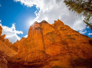 sun over a canyon wall in Utah 