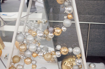 beautiful silver and gold christmas balls on a silver background