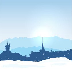 Lausanne winter skyline with mountains and snow.