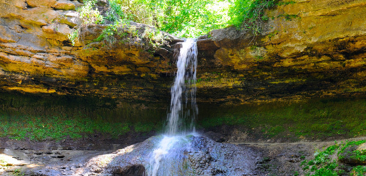 Waterfalls in the Saharna, Rezina region, Republic of Moldova seen on a bright sunny summer day. Wide photo.