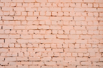 The brick wall is pink. Texture, background.