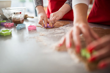 Girl cutting out shapes from dough